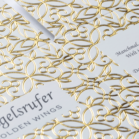 Veredelung: Reliefprägung Gold